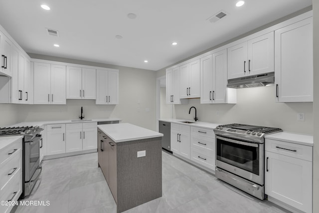 24 Golders Green Rd, Lakewood, NJ 08701 - kitchen with appliances with stainless steel finishes, under cabinet range hood, a sink, a kitchen island, and recessed lighting