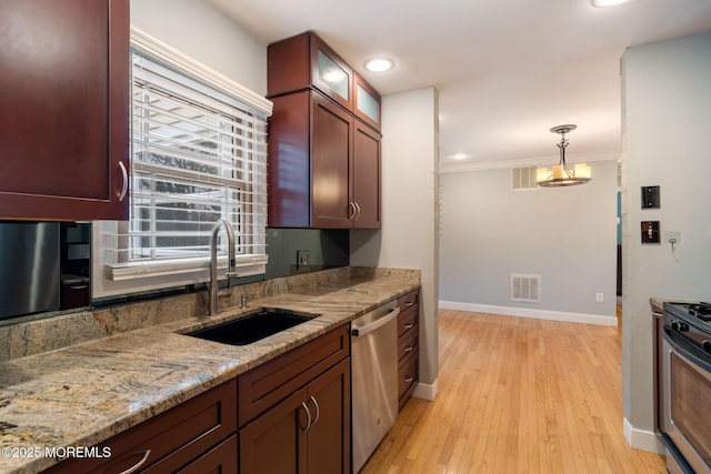 123 Nautilus Dr, Manahawkin, NJ 08050 - kitchen featuring a sink, appliances with stainless steel finishes, baseboards, light wood finished floors, and recessed lighting