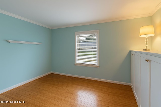 123 Nautilus Dr, Manahawkin, NJ 08050 - empty room featuring crown molding, light wood finished floors, and baseboards