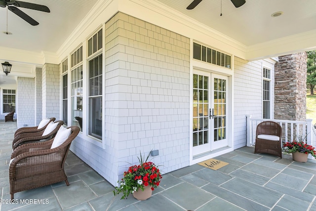 view of patio with ceiling fan, french doors, and a porch
