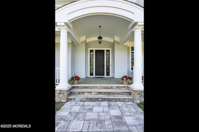 entrance to property featuring a porch