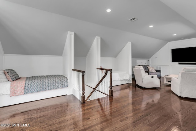 bedroom with vaulted ceiling, wood finished floors, and recessed lighting