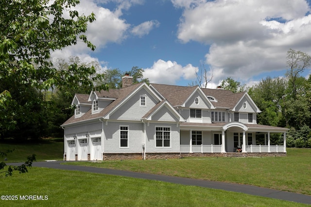 shingle-style home featuring a porch, a front yard, a chimney, and roof with shingles
