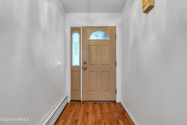 11 S Point Ct, Toms River, NJ 08757 - doorway with wood finished floors, baseboards, and a baseboard heating unit