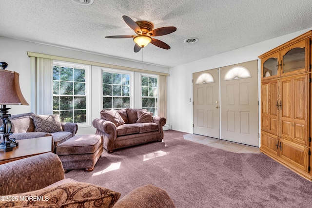 11 S Point Ct, Toms River, NJ 08757 - living room featuring a ceiling fan, light colored carpet, a textured ceiling, a baseboard heating unit, and light tile patterned floors