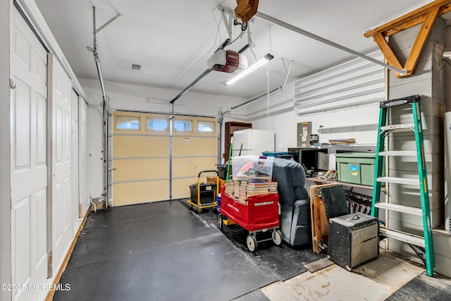 11 S Point Ct, Toms River, NJ 08757 - garage with a garage door opener and freestanding refrigerator