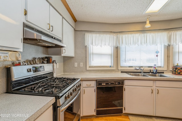 9 Copperfield Dr, Cream Ridge, NJ 08514 - kitchen with stainless steel gas range oven, under cabinet range hood, black dishwasher, light countertops, and a textured ceiling