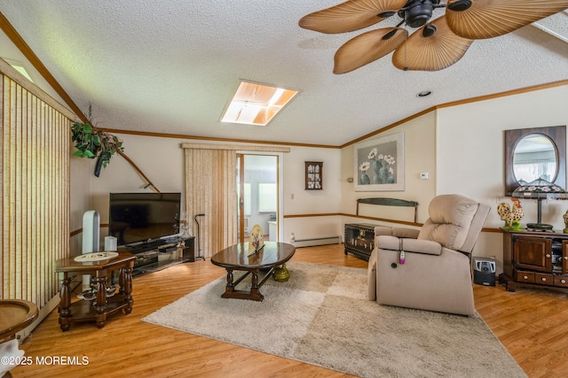 9 Copperfield Dr, Cream Ridge, NJ 08514 - living area with crown molding, a baseboard radiator, wood finished floors, a textured ceiling, and a ceiling fan