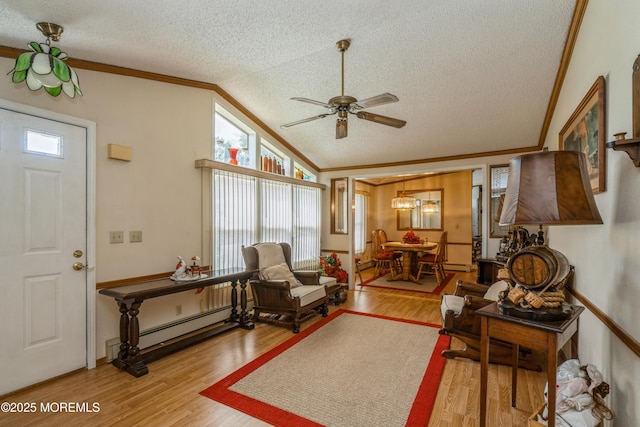 9 Copperfield Dr, Cream Ridge, NJ 08514 - living area featuring ornamental molding, a textured ceiling, ceiling fan, wood finished floors, and vaulted ceiling