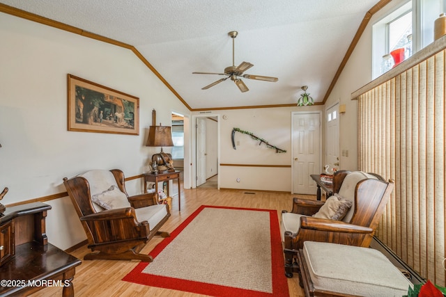 9 Copperfield Dr, Cream Ridge, NJ 08514 - living area with vaulted ceiling, a ceiling fan, wood finished floors, and crown molding