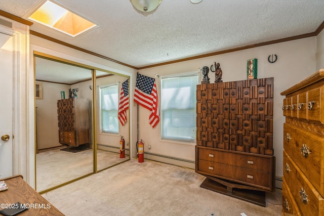9 Copperfield Dr, Cream Ridge, NJ 08514 - unfurnished bedroom with ornamental molding, carpet flooring, a baseboard heating unit, a textured ceiling, and a closet