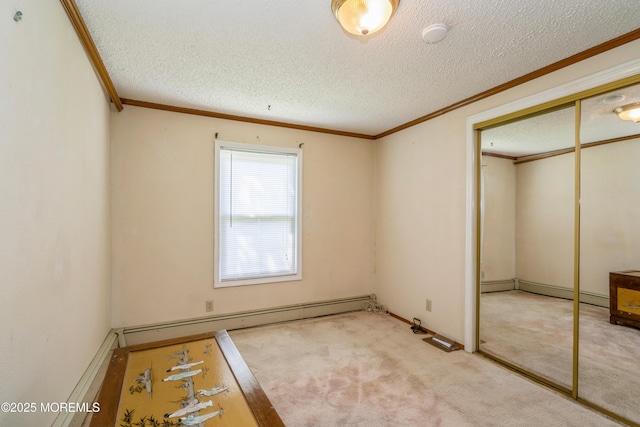 9 Copperfield Dr, Cream Ridge, NJ 08514 - unfurnished bedroom featuring baseboard heating, ornamental molding, a closet, a textured ceiling, and carpet flooring