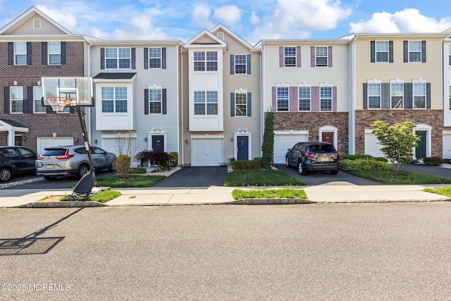 111 Warbler Way Unit 1000, Freehold, NJ 07728 - view of property featuring driveway, an attached garage, and stone siding