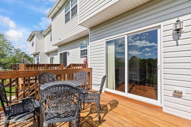 111 Warbler Way Unit 1000, Freehold, NJ 07728 - wooden terrace with outdoor dining area