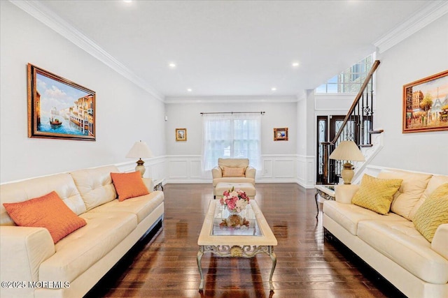 living area with stairway, wood finished floors, crown molding, a wainscoted wall, and a decorative wall