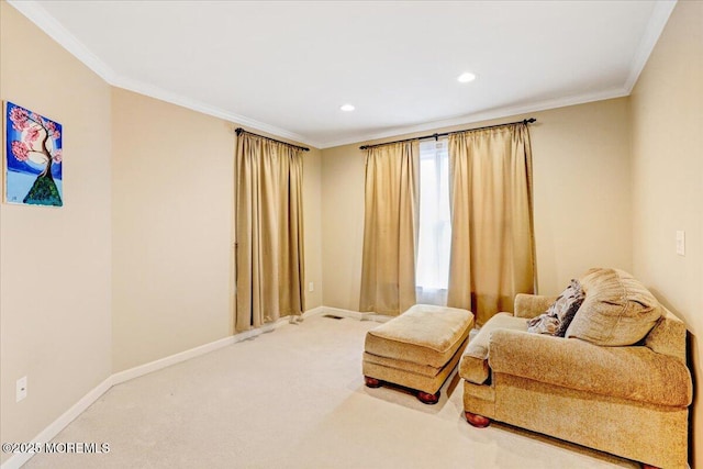sitting room with carpet floors, ornamental molding, baseboards, and recessed lighting