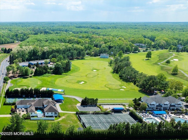 aerial view of a golf course and a forest