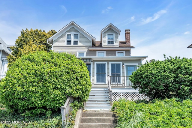 58 River Ave, Island Heights, NJ 08732 - victorian-style house with a chimney, stairs, and a porch