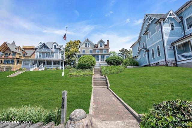 58 River Ave, Island Heights, NJ 08732 - view of property's community with a lawn and stairway