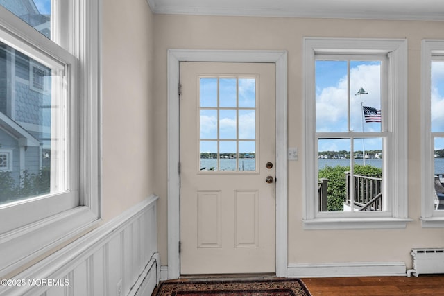 58 River Ave, Island Heights, NJ 08732 - doorway to outside with a water view, plenty of natural light, a baseboard radiator, crown molding, and wood finished floors