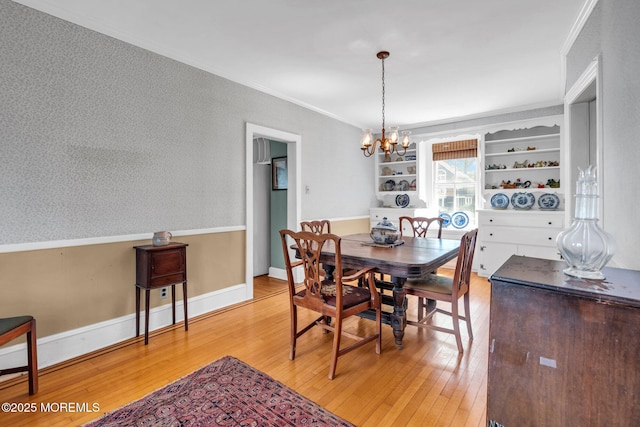 58 River Ave, Island Heights, NJ 08732 - dining room featuring a chandelier, light wood finished floors, ornamental molding, and baseboards