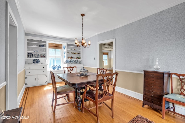 58 River Ave, Island Heights, NJ 08732 - dining room with light wood-style floors, crown molding, and a chandelier