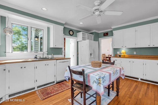 58 River Ave, Island Heights, NJ 08732 - kitchen with white appliances, ornamental molding, white cabinets, light wood finished floors, and recessed lighting