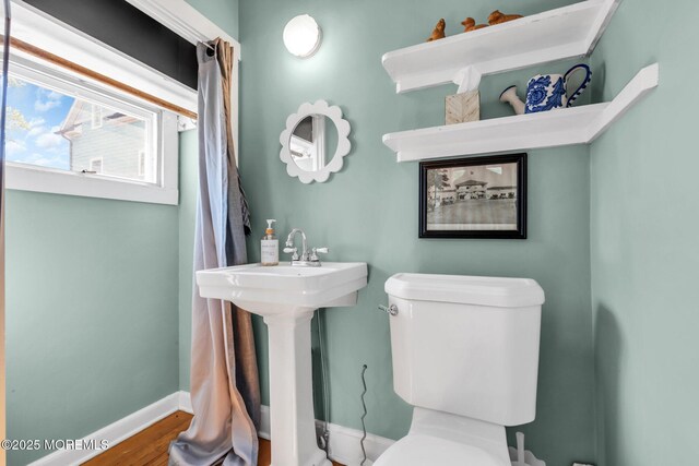 58 River Ave, Island Heights, NJ 08732 - half bath with baseboards, toilet, and wood finished floors