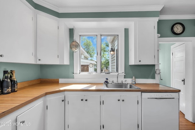 58 River Ave, Island Heights, NJ 08732 - kitchen with white dishwasher, a sink, white cabinets, light countertops, and crown molding