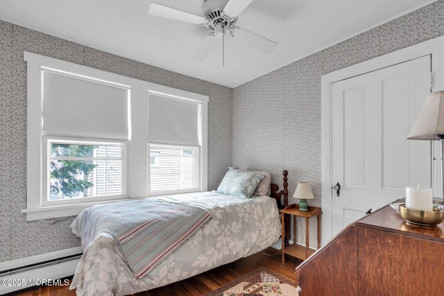 58 River Ave, Island Heights, NJ 08732 - bedroom featuring wallpapered walls, wood finished floors, a baseboard heating unit, and a ceiling fan