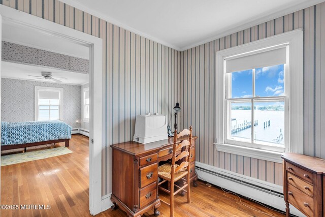 58 River Ave, Island Heights, NJ 08732 - office area with wallpapered walls, wood finished floors, a baseboard heating unit, ornamental molding, and a ceiling fan