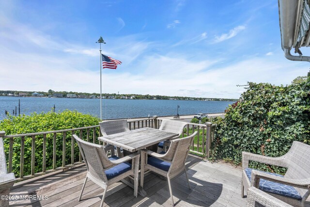 58 River Ave, Island Heights, NJ 08732 - wooden deck featuring a water view and outdoor dining space