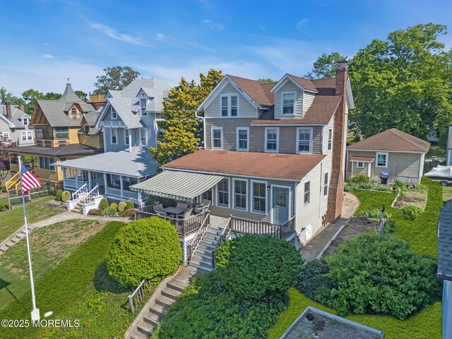 58 River Ave, Island Heights, NJ 08732 - rear view of property with stairway, a deck, a chimney, a residential view, and roof with shingles
