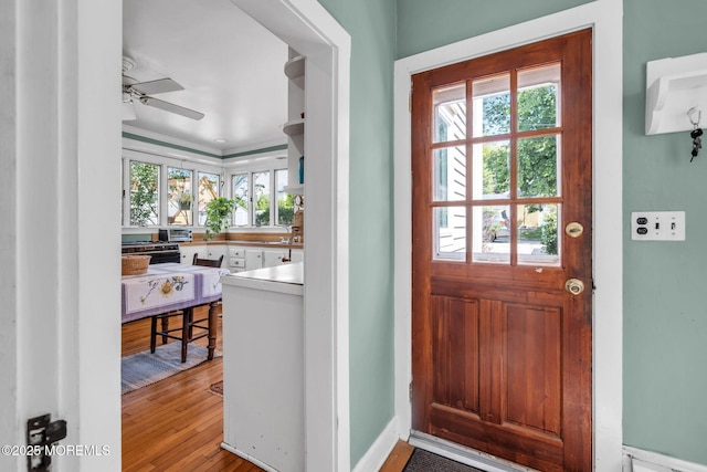 58 River Ave, Island Heights, NJ 08732 - doorway to outside with ceiling fan, wood finished floors, ornamental molding, and baseboards