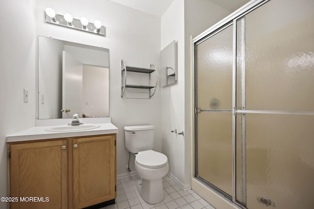 full bath with a stall shower, toilet, tile patterned flooring, vanity, and baseboards