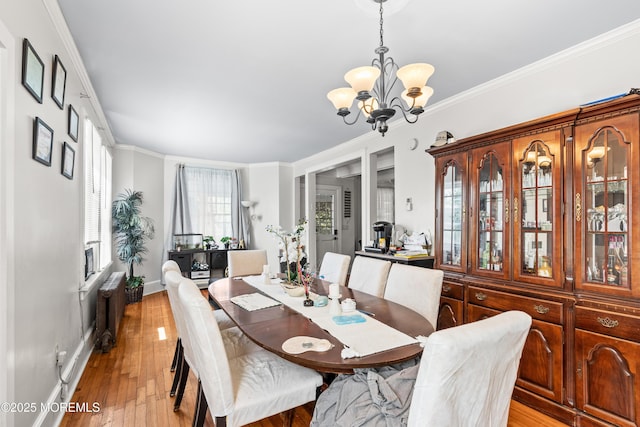 329 Hollywood Ave, Long Branch, NJ 07740 - dining area with a chandelier, ornamental molding, radiator heating unit, and light wood finished floors