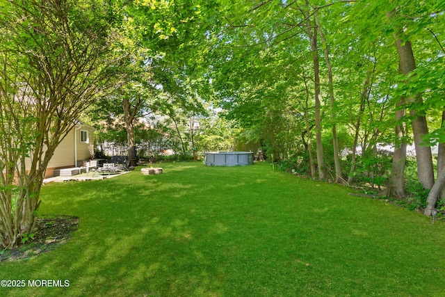 329 Hollywood Ave, Long Branch, NJ 07740 - view of grassy yard with a pool and a patio