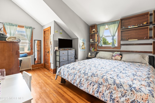 329 Hollywood Ave, Long Branch, NJ 07740 - bedroom featuring radiator, wood finished floors, multiple windows, and lofted ceiling