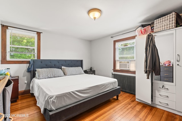 329 Hollywood Ave, Long Branch, NJ 07740 - bedroom with radiator heating unit and light wood-style flooring