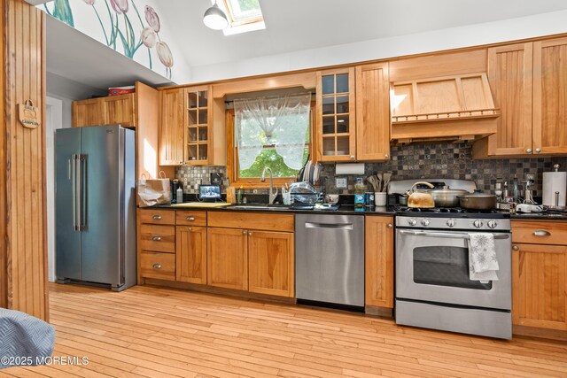 329 Hollywood Ave, Long Branch, NJ 07740 - kitchen with stainless steel appliances, custom exhaust hood, a sink, dark countertops, and decorative backsplash