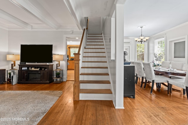 329 Hollywood Ave, Long Branch, NJ 07740 - stairs with a chandelier, wood-type flooring, and ornamental molding