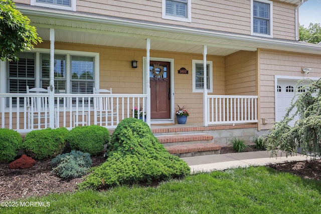 property entrance with covered porch