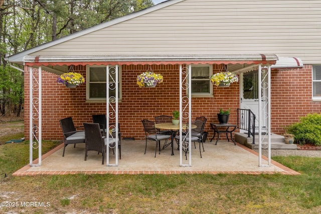 2A Jackson Ct, Whiting, NJ 08759 - back of house featuring brick siding, a patio area, and a yard