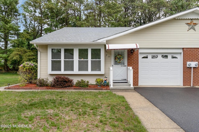 2A Jackson Ct, Whiting, NJ 08759 - ranch-style home featuring asphalt driveway, a front yard, roof with shingles, a garage, and brick siding