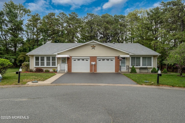 2A Jackson Ct, Whiting, NJ 08759 - ranch-style home featuring a garage, asphalt driveway, a front yard, and view of wooded area