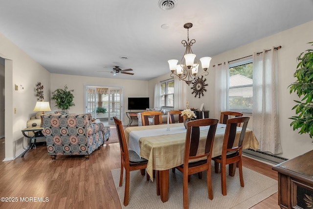2A Jackson Ct, Whiting, NJ 08759 - dining area with a baseboard radiator, light wood-style floors, a chandelier, and ceiling fan