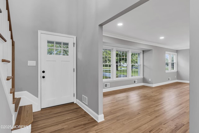 92 Sargent Rd, Freehold, NJ 07728 - foyer with ornamental molding, baseboards, light wood-style flooring, stairway, and recessed lighting