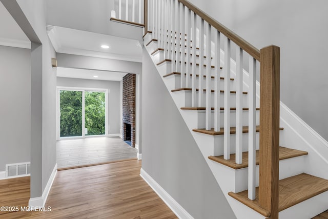 92 Sargent Rd, Freehold, NJ 07728 - staircase with wood finished floors, baseboards, recessed lighting, and ornamental molding