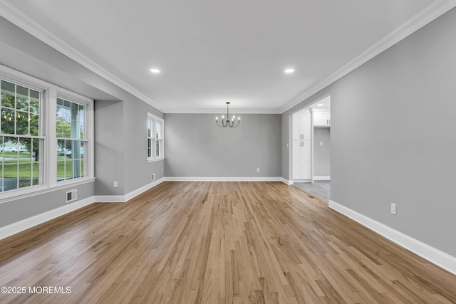 92 Sargent Rd, Freehold, NJ 07728 - unfurnished room with a chandelier, light wood finished floors, baseboards, ornamental molding, and recessed lighting