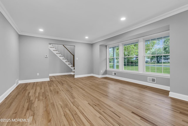 92 Sargent Rd, Freehold, NJ 07728 - unfurnished living room with stairway, crown molding, light wood-style flooring, baseboards, and recessed lighting